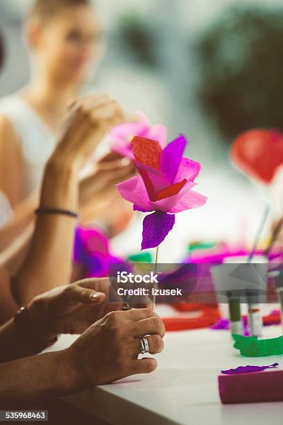 Women Making Paper Flowers Stock Photo - Download Image Now - 2015, Adult, Art