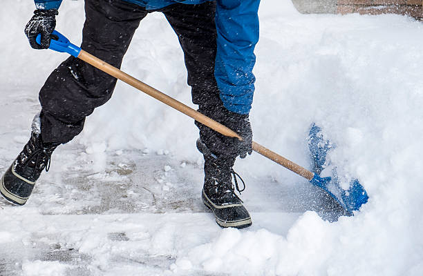 istock Man Removing Snow with a Shovel 535969759