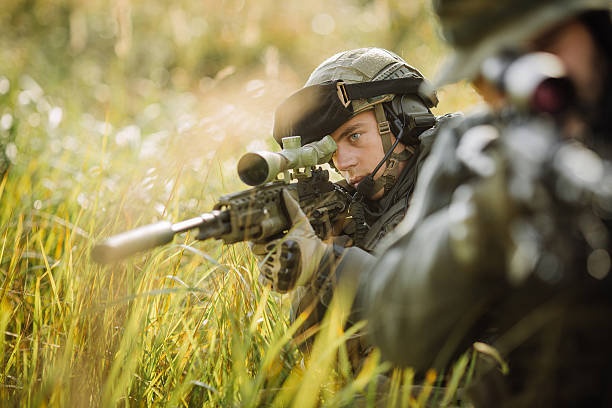 istock military soldier shooting an assault rifle 535970303