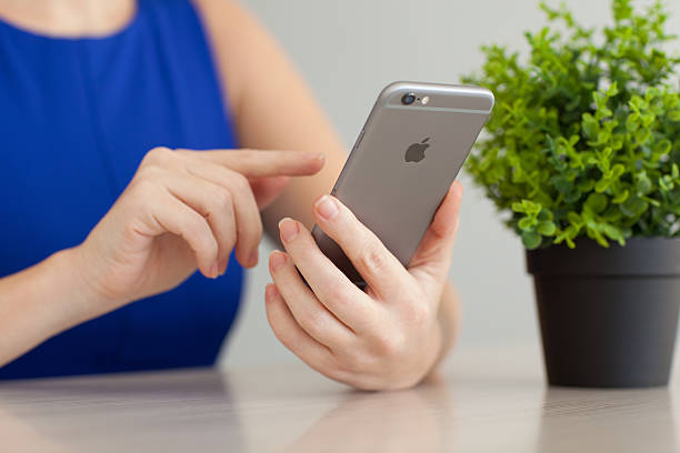 Hand of business people holding smartphone - mobile phone.
