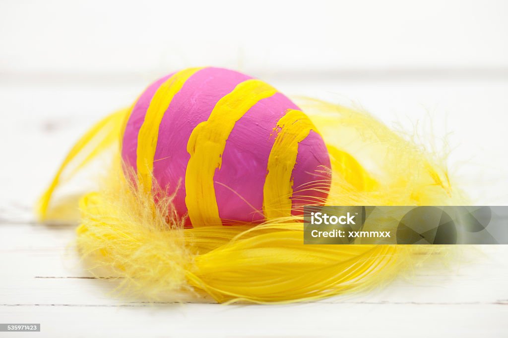 Colorful easter egg on white table Colorful easter egg on white table. This file is cleaned and retouched. 2015 Stock Photo