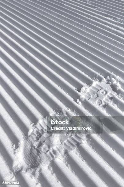 Foot Track On The Fresh Striped Prepared Slope Stock Photo - Download Image Now - 2015, Backgrounds, Caterpillar Track