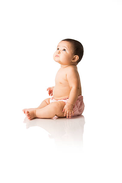 Cute baby girl looking up