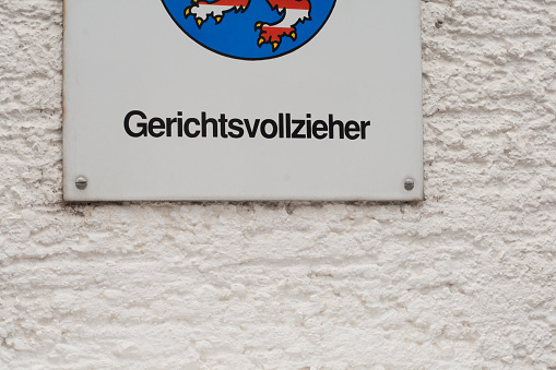 German sign with the word bailiff on a wall