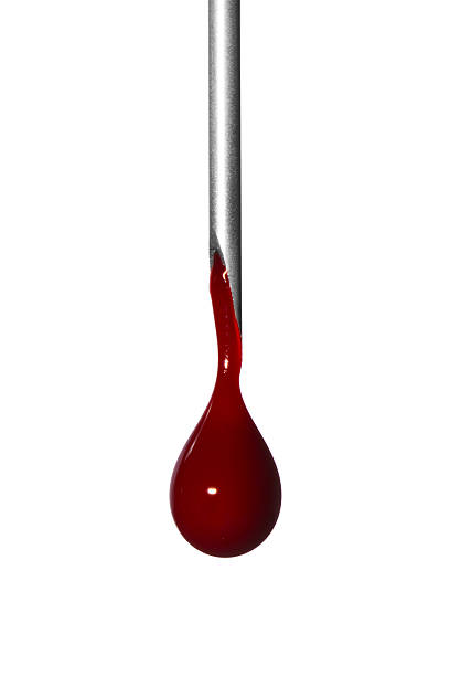 Drop of blood hanging from tip of hypodermic needle Close-up of blood dripping from the end of a syringe needle, isolated on white background blood drop stock pictures, royalty-free photos & images