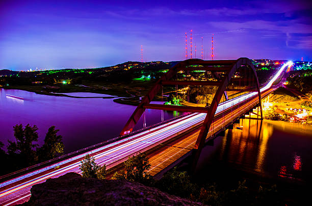 istock Night 360 Pennybacker Bridge Blue Night Sky headlight Trails 535982607