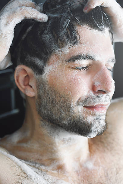 istock Man washing his hair. 535984433