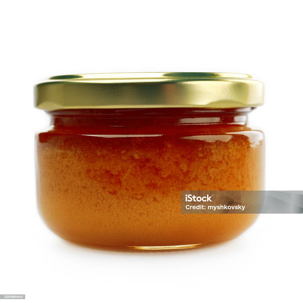 Close-up jar of honey on white background 2015 Stock Photo