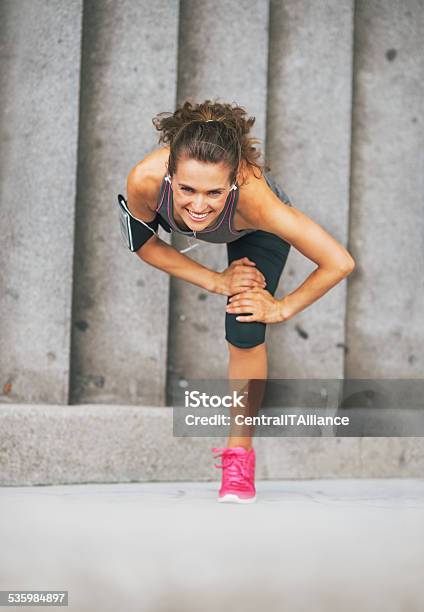 Happy Fitness Young Woman Stretching Outdoors In The City Stock Photo - Download Image Now