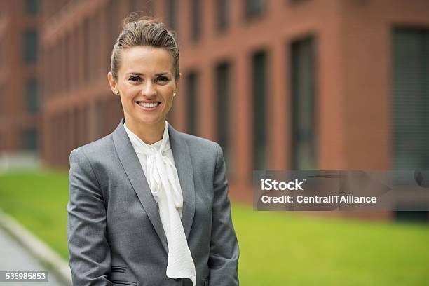 Smiling Business Woman In Front Of Office Building Stock Photo - Download Image Now - Adult, Adults Only, Brown Hair