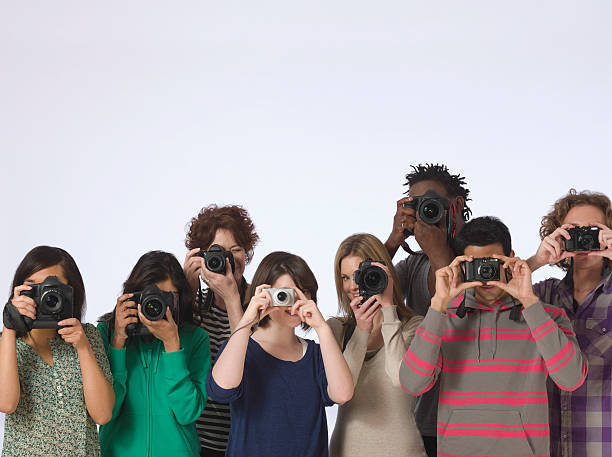 istock Multiethnic Photographers Taking Photos 535986351