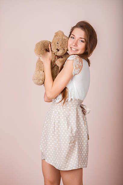 istock Girl and teddy bear 535988405