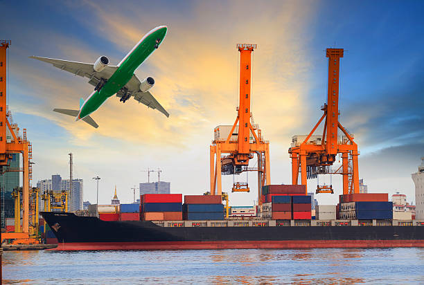 istock ship in port and plane flying above 535988689