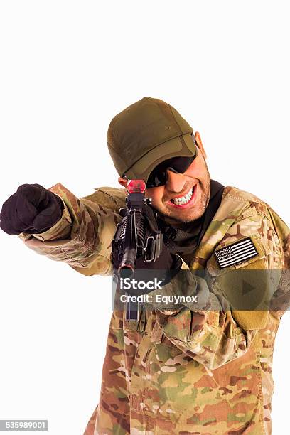 Young Army Soldier Assaulting Position Stock Photo - Download Image Now - 2015, Adult, Armed Forces