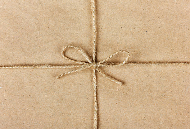 istock string or twine tied in bow on kraft paper background 535989883