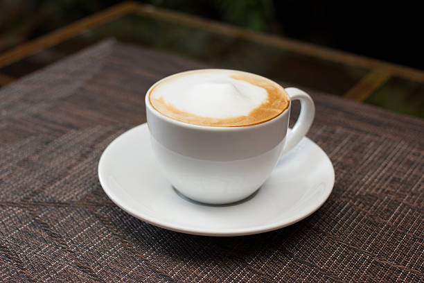 istock Cup of cappuccino over wooden table 535990793