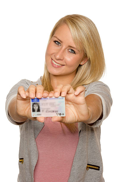 istock Young woman showing her driver's license 535991915