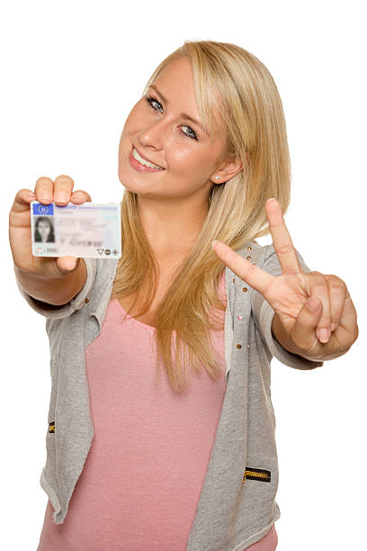 istock Young woman showing her driver's license 535991947