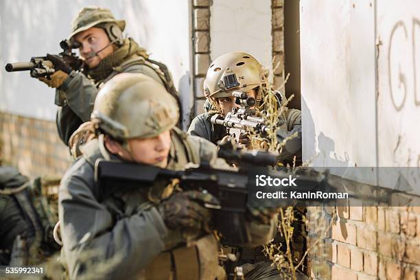 Soldiers With Rifles Patrolling During War Stock Photo - Download Image Now - 2015, Activity, Adult