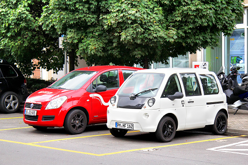 Berlin, Germany - September 12, 2013: Modern electric cars parked at the city street.