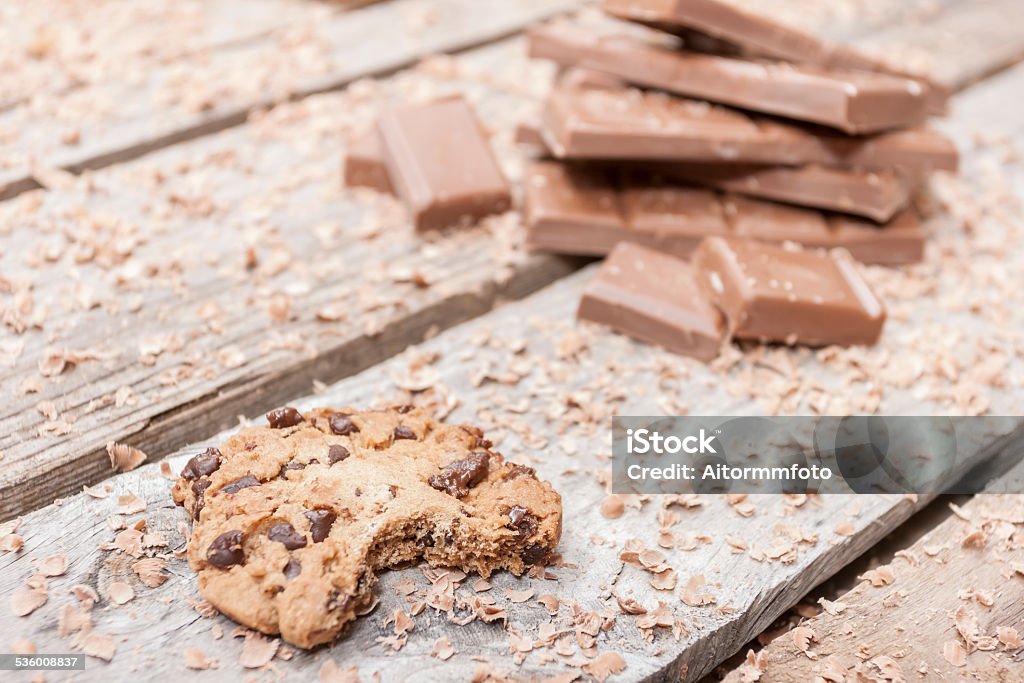 Chocolate chip cookies Bitten homemade chocolate chip cookies on wooden background 2015 Stock Photo