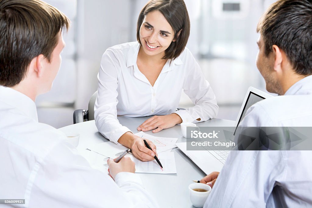 Group of business people Group of business people busy discussing financial matter during meeting 2015 Stock Photo