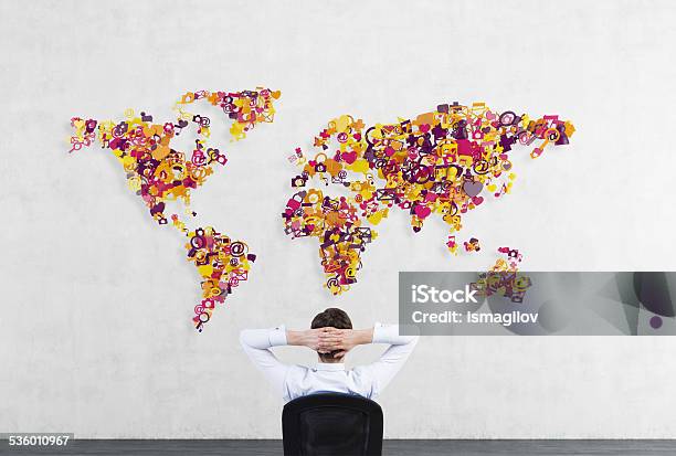 Businessman Looking To World Map Stock Photo - Download Image Now - File Folder, Globe - Navigational Equipment, World Map