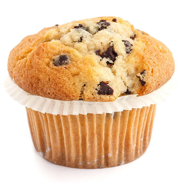 istock Single light chocolate chip muffin in wax liner on white. 536011491