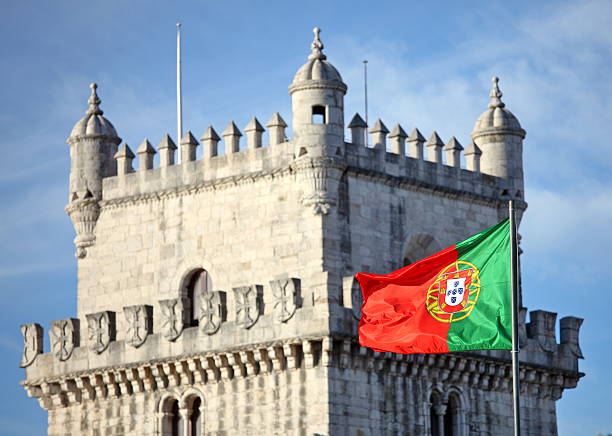 Belem Tower in Lisbon and Portuguese national flag