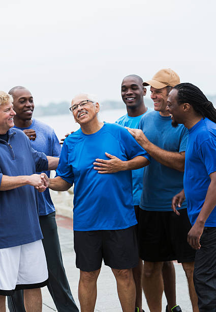 istock Hispanic senior man with supportive friends 536012337