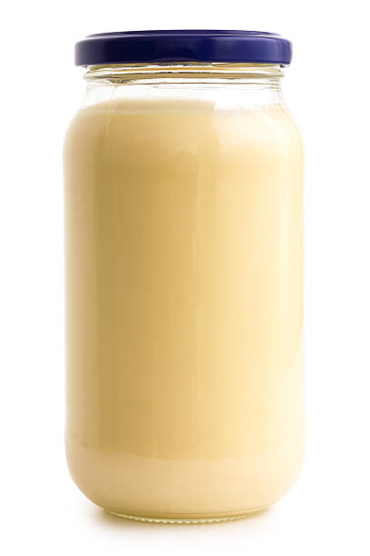 istock Glass mayonnaise jar with blue lid on white. 536013555