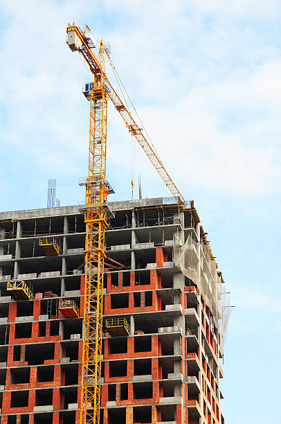 istock Yellow Crane On A Highrise Construction Site 536014881