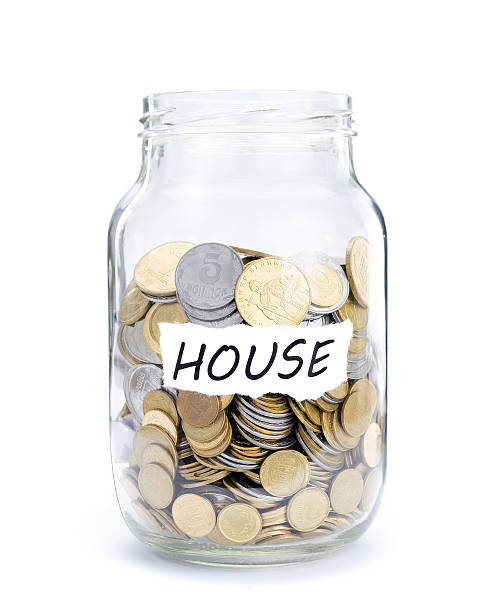 Jar with coins on House Jar with coins on House, money isolated on white. australian 5 cents stock pictures, royalty-free photos & images