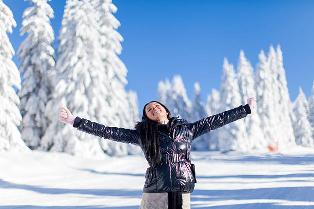 istock Young woman on the mountain at winter 536015631
