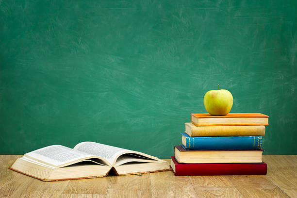 istock pile of books with one book open 536017353