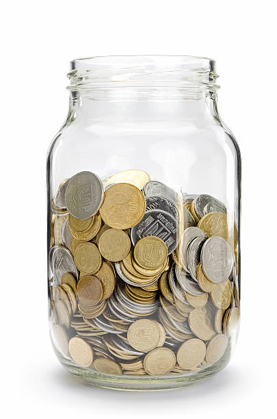 Jar with coins Jar with coins, money isolated on white. australian 5 cents stock pictures, royalty-free photos & images
