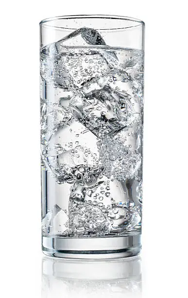 Photo of Glass of mineral water with ice. With clipping path