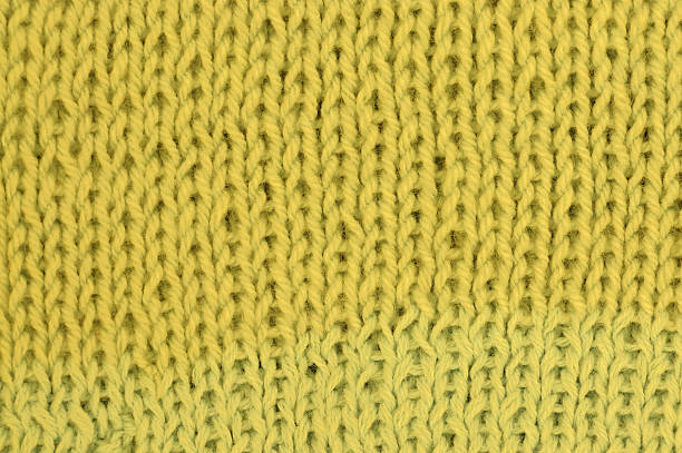 istock Knit woolen texture background. Fabric yellow background 536026599