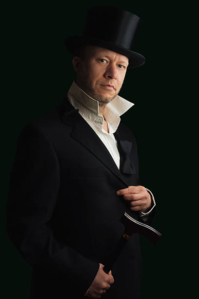 istock Middle aged man in suit with cane and Top Hat 536027403
