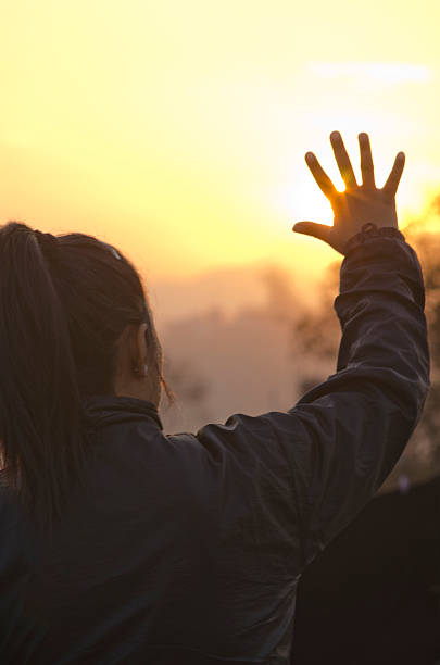 istock Woman showing palm into the sun 536027737