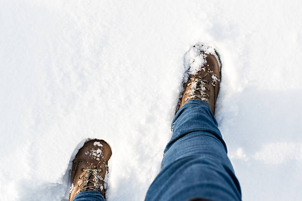istock Hiking boots in the snow 536028129