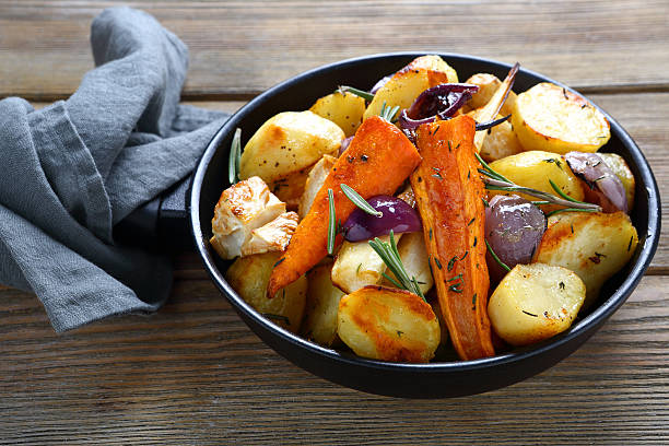 istock Oven-baked vegetables pieces with herbs 536030065