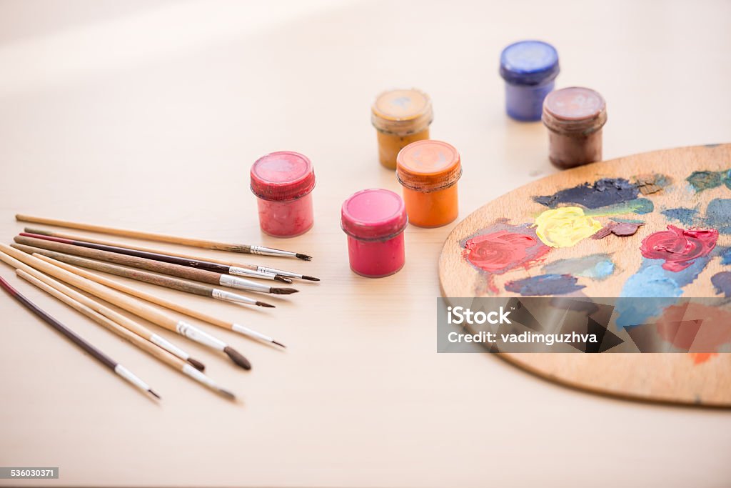 Artist Close-up image of brushes, paints and palette on the table. 2015 Stock Photo