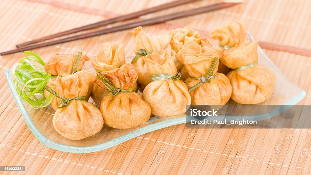 Wonton Wonton - Oriental deep fried wontons filled with vegetables. Dumpling Stock Photo