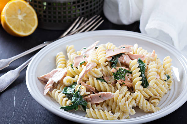 istock Pasta fusilli with baked salmon and spinach 536033135