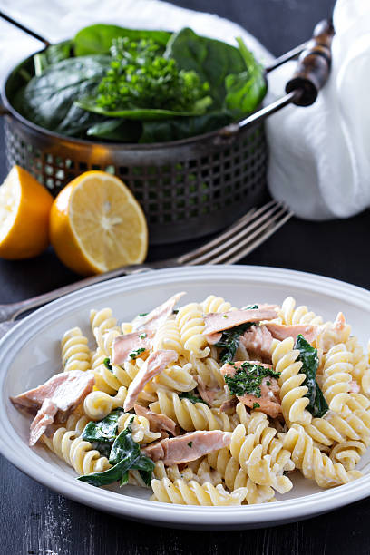 istock Pasta fusilli with baked salmon and spinach 536033137