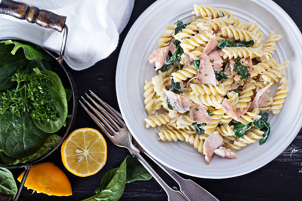 istock Pasta fusilli with baked salmon and spinach 536033141