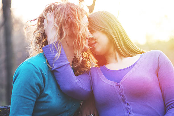 istock Lesbian couple relax embracing at the park 536034087