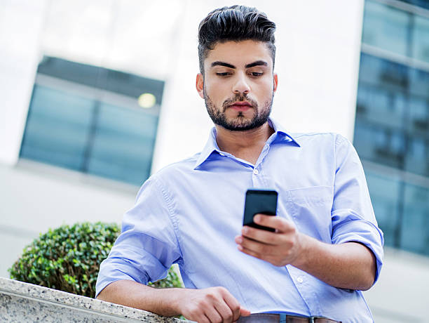 istock Hispanic businessman using smart phone outdoors. 536034095