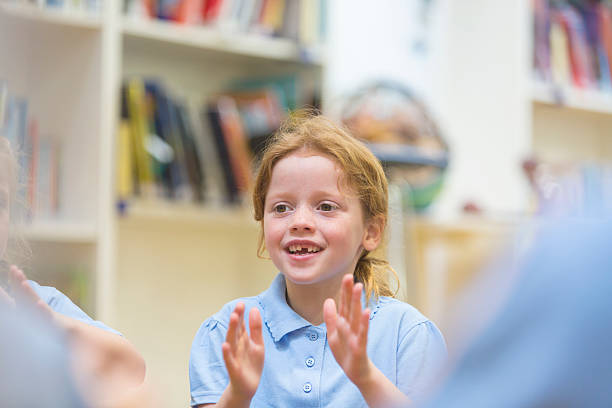 istock Young School Girl Smiling and Clapping 536034131